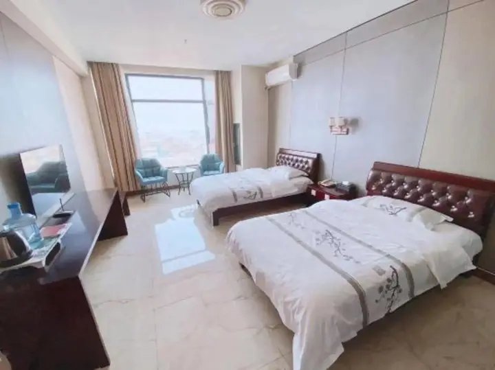 Линьи: Huanle Business Hotel