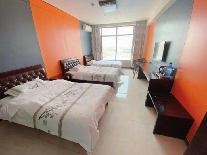 Линьи: Huanle Business Hotel