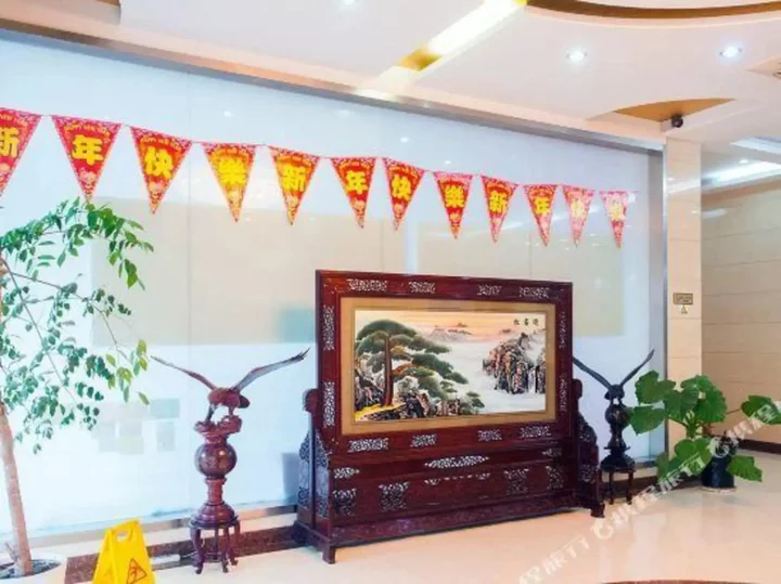 Наньтун: Xinding Business Hotel