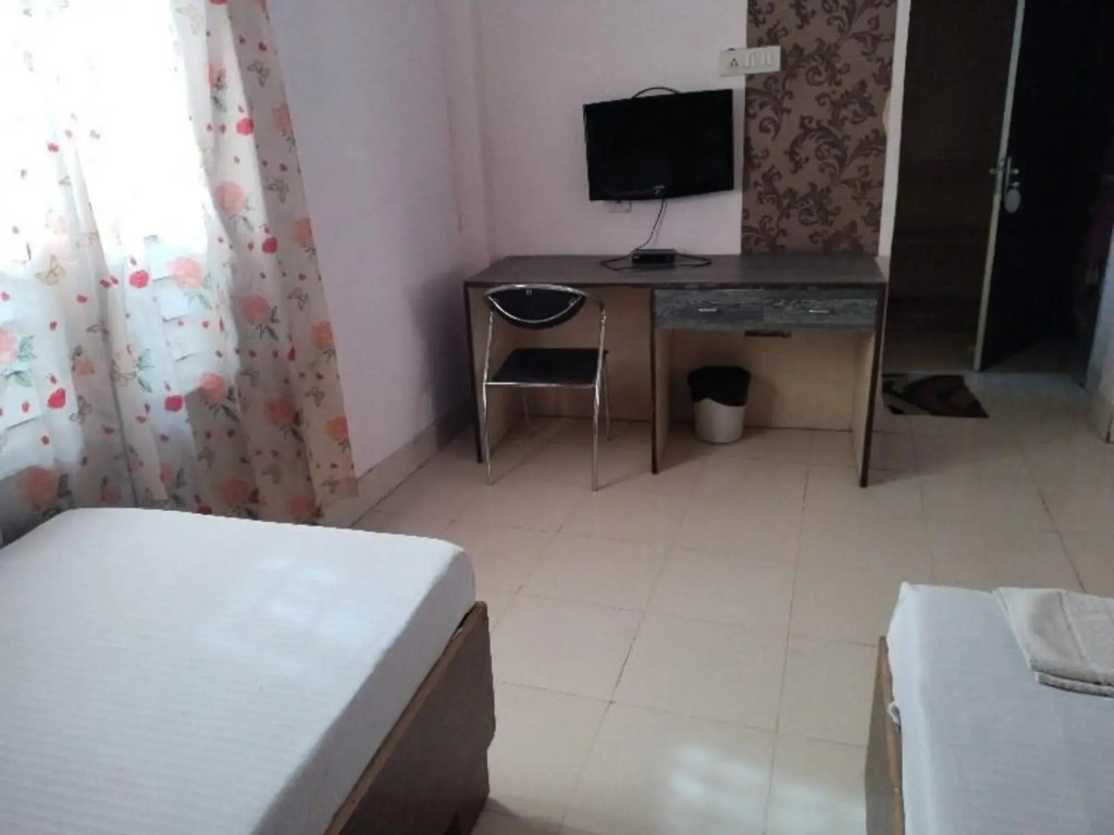 Дибругарх: Capital O 8801 Hotel JS Tower