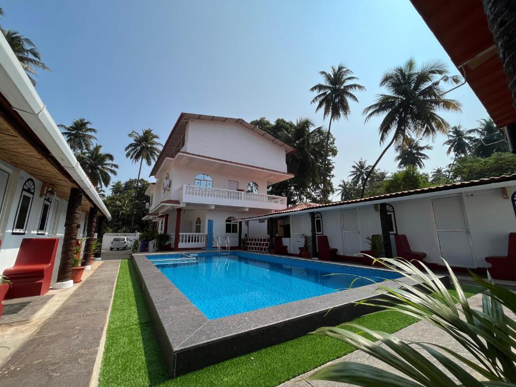 Морджим: Pool Side Cottages in La Paulo's B2B in Morjim
