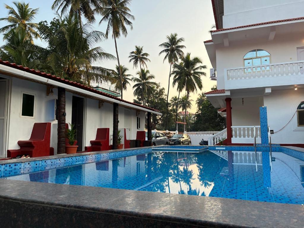 Морджим: Pool Side Cottages in La Paulo's B2B in Morjim