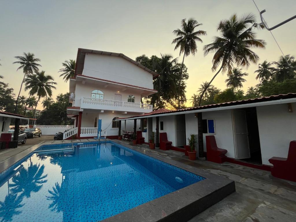 Морджим: Pool Side Cottages in La Paulo's B2B in Morjim