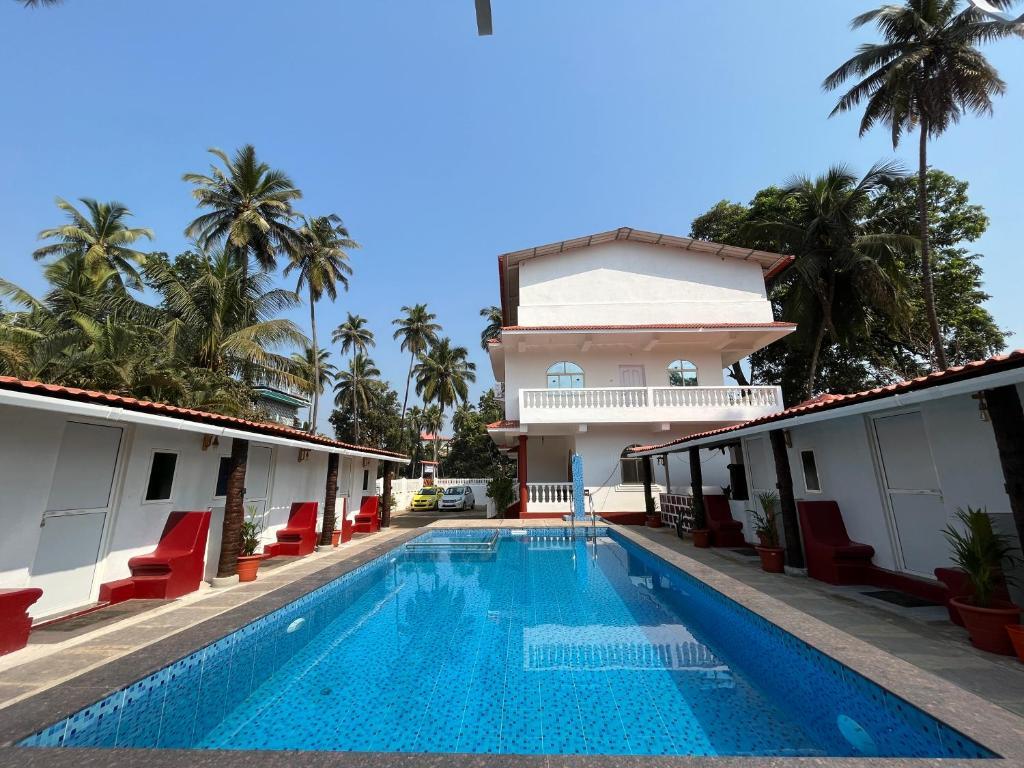 Морджим: Pool Side Cottages in La Paulo's B2B in Morjim