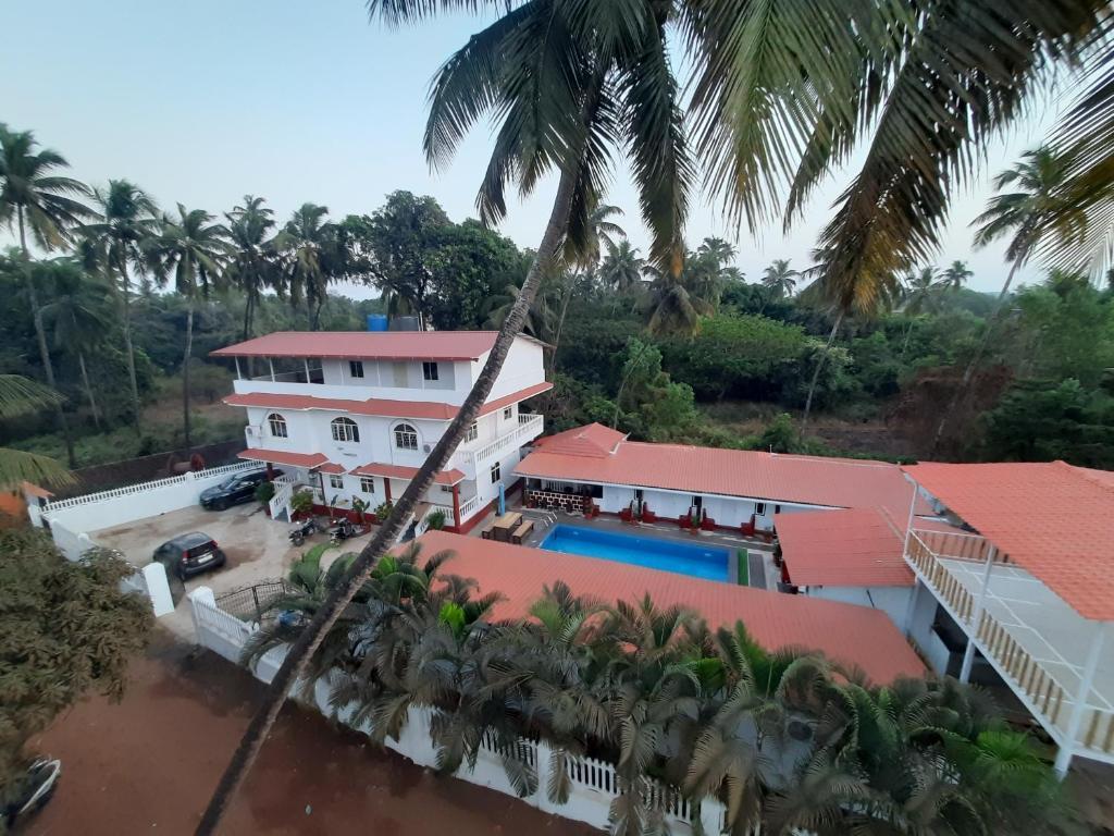 Морджим: Pool Side Cottages in La Paulo's B2B in Morjim