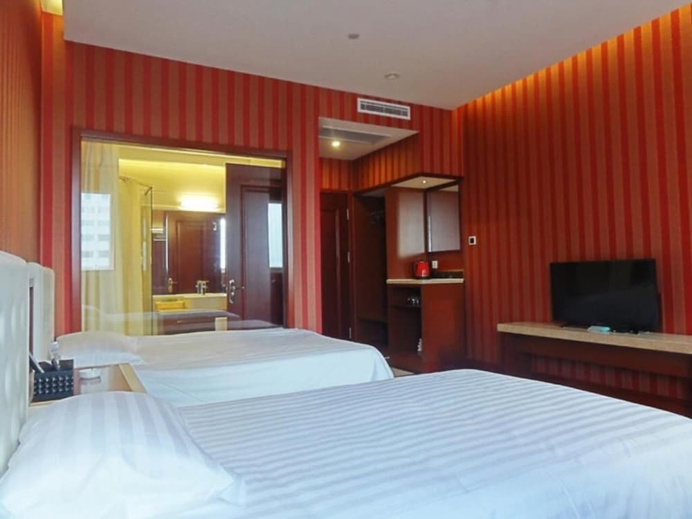 Циндао: Qingdao Hua Qi Kai Di Hotel