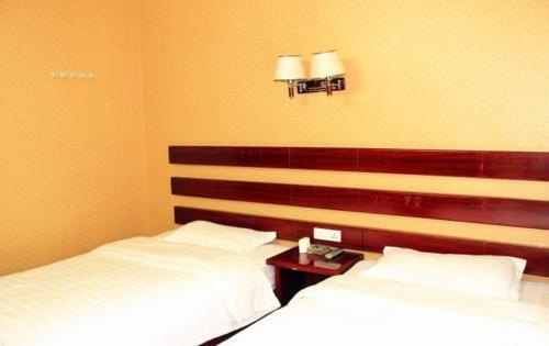 Эньши: Enshi Qingju Business Inn