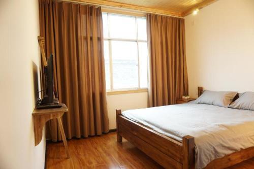 Синъи: Xingyi Wanfeng Lin Jianshan Guest House