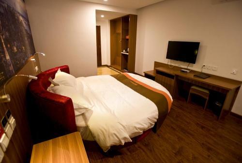 Хецзе: JUNYI Hotel Shandong Heze Dongming County Government Building