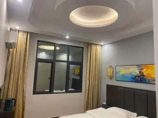 Синъи: Xingyi Rongfa Boutique Hotel