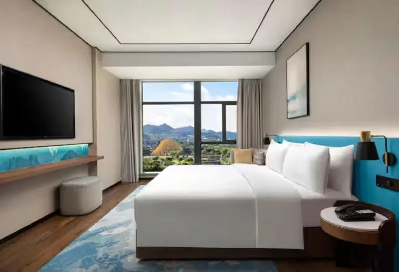 Синъи: Hilton Garden Inn Xingyi Wanfenglin