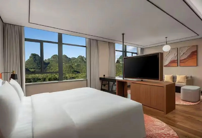 Синъи: Hilton Garden Inn Xingyi Wanfenglin