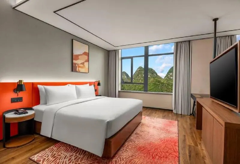 Синъи: Hilton Garden Inn Xingyi Wanfenglin
