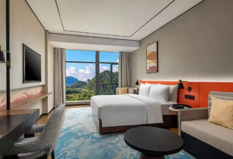 Синъи: Hilton Garden Inn Xingyi Wanfenglin