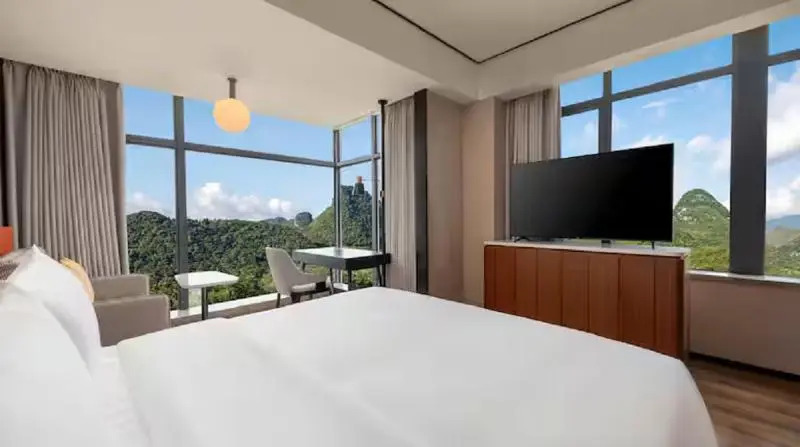 Синъи: Hilton Garden Inn Xingyi Wanfenglin