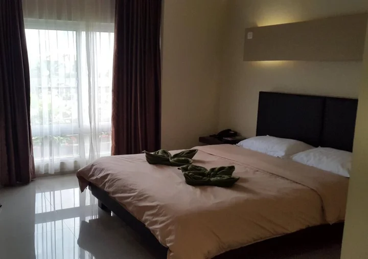 Томохон: Jhoanie Hotel