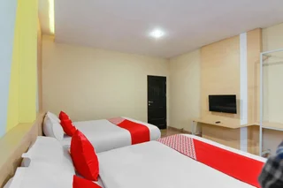 Медан: Capital O 3476 Millenium Inn