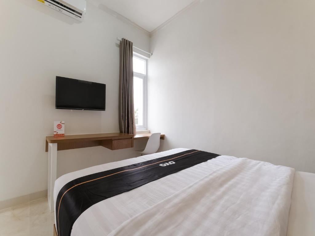 Super OYO Collection O 90023 Damar Kusumo Guest House — фото 4