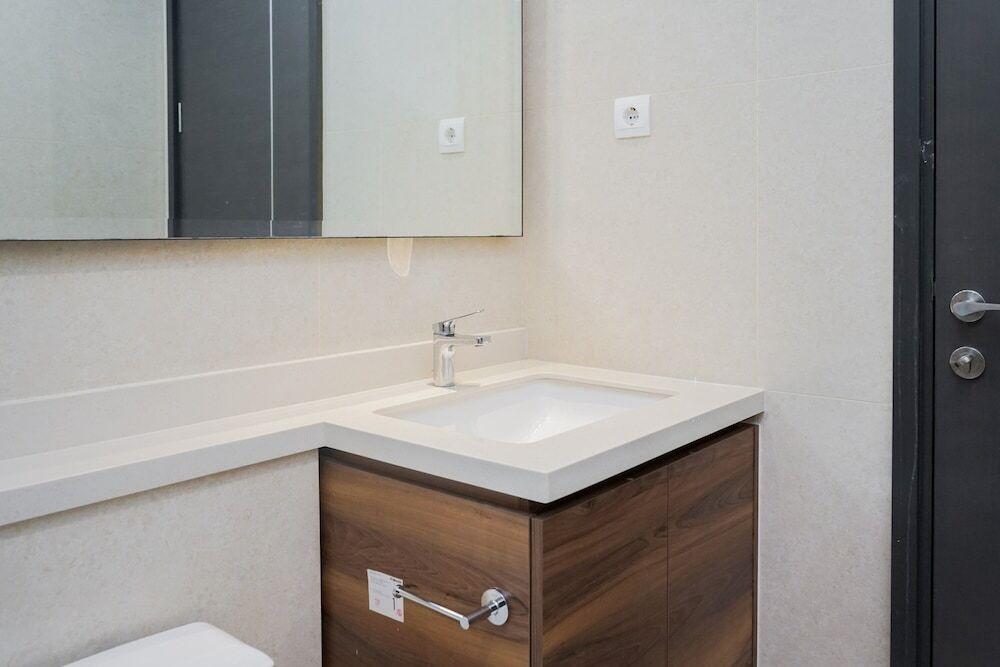 Legok: Cozy and New 2BR at Marigold Nava Park Apartment