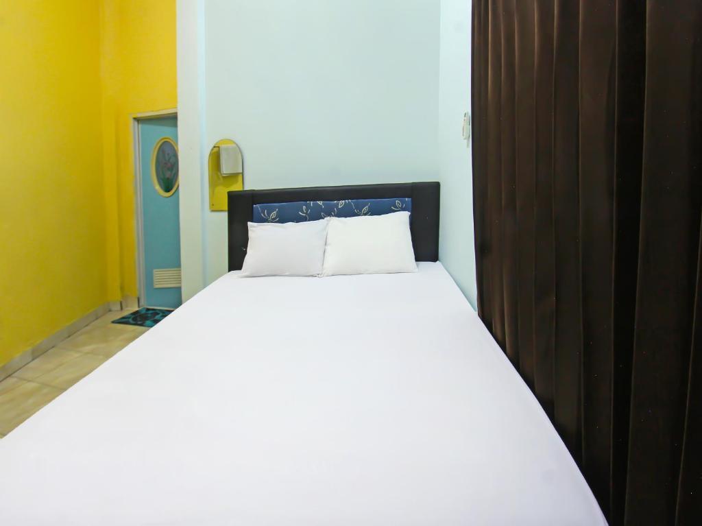 Прайя: OYO 92095 Wisma Dhana Syariah
